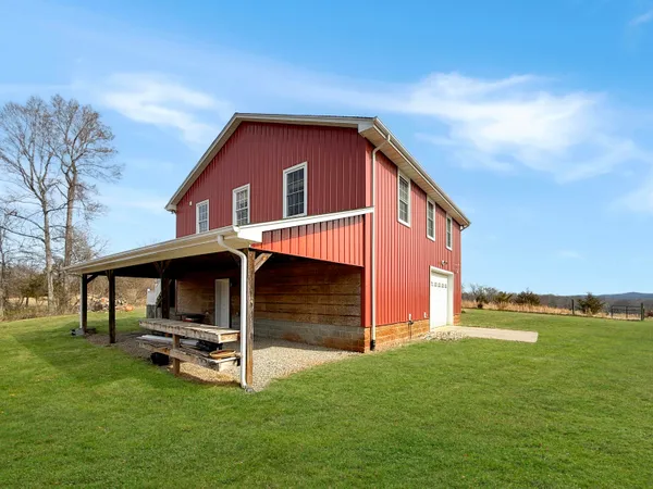 a view of backyard with a garden and entertaining space