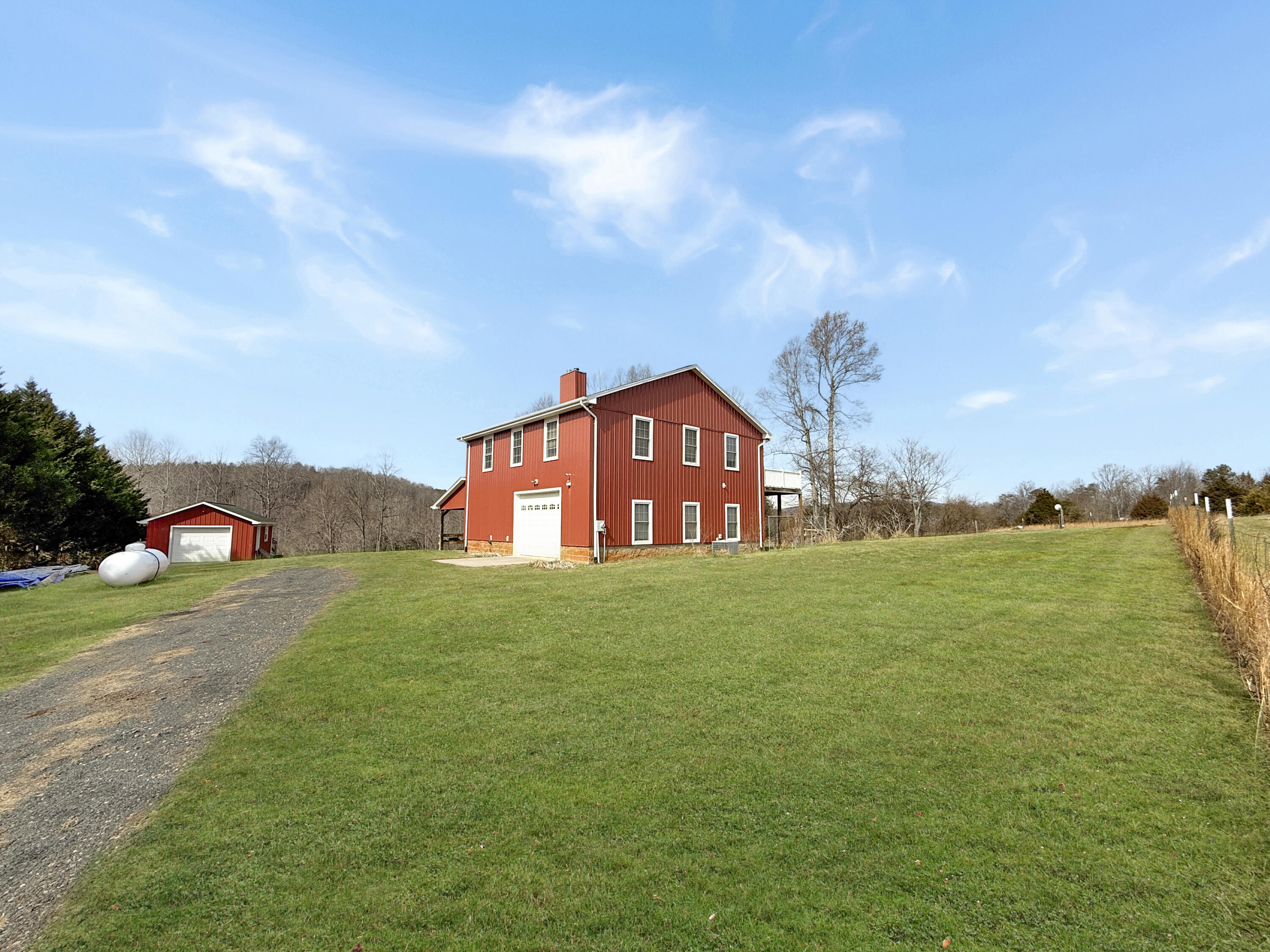 10820 Sontag Road Martinsville, VA 24112 - Photo 5 of 37 a front view of a house with a yard and garage