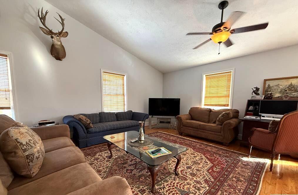 10820 Sontag Road Martinsville, VA 24112 - Photo 9 of 37 a living room with furniture a flat screen tv and a window
