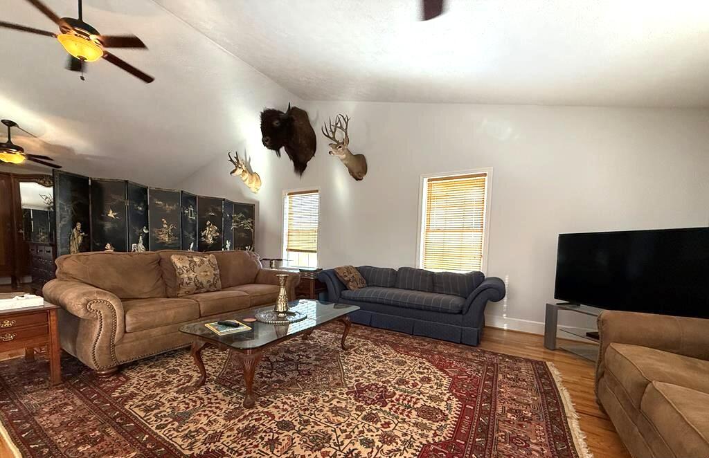 10820 Sontag Road Martinsville, VA 24112 - Photo 10 of 37 a living room with furniture and a flat screen tv