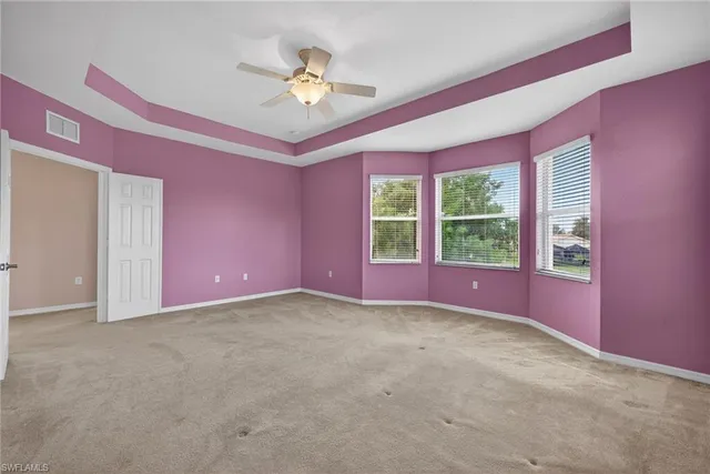 a view of an empty room with windows