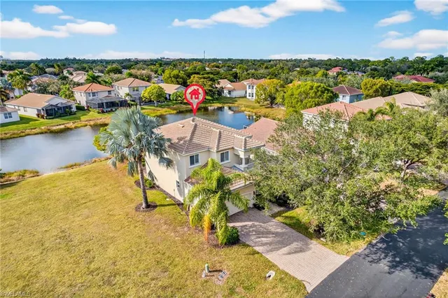 an aerial view of a residential houses with outdoor space