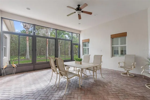 a view of backyard of house with green space