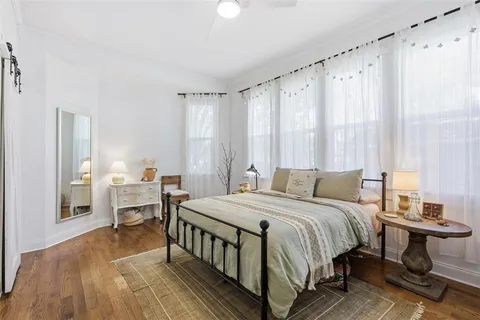 a bedroom with a bed and a table