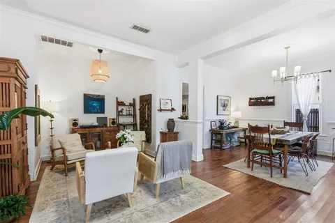 a living room with lots of furniture and a large window
