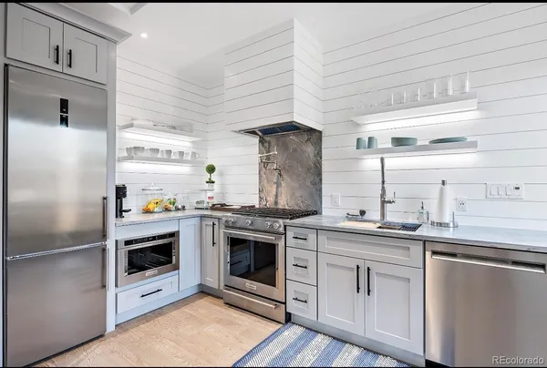 a kitchen with a stove and a refrigerator