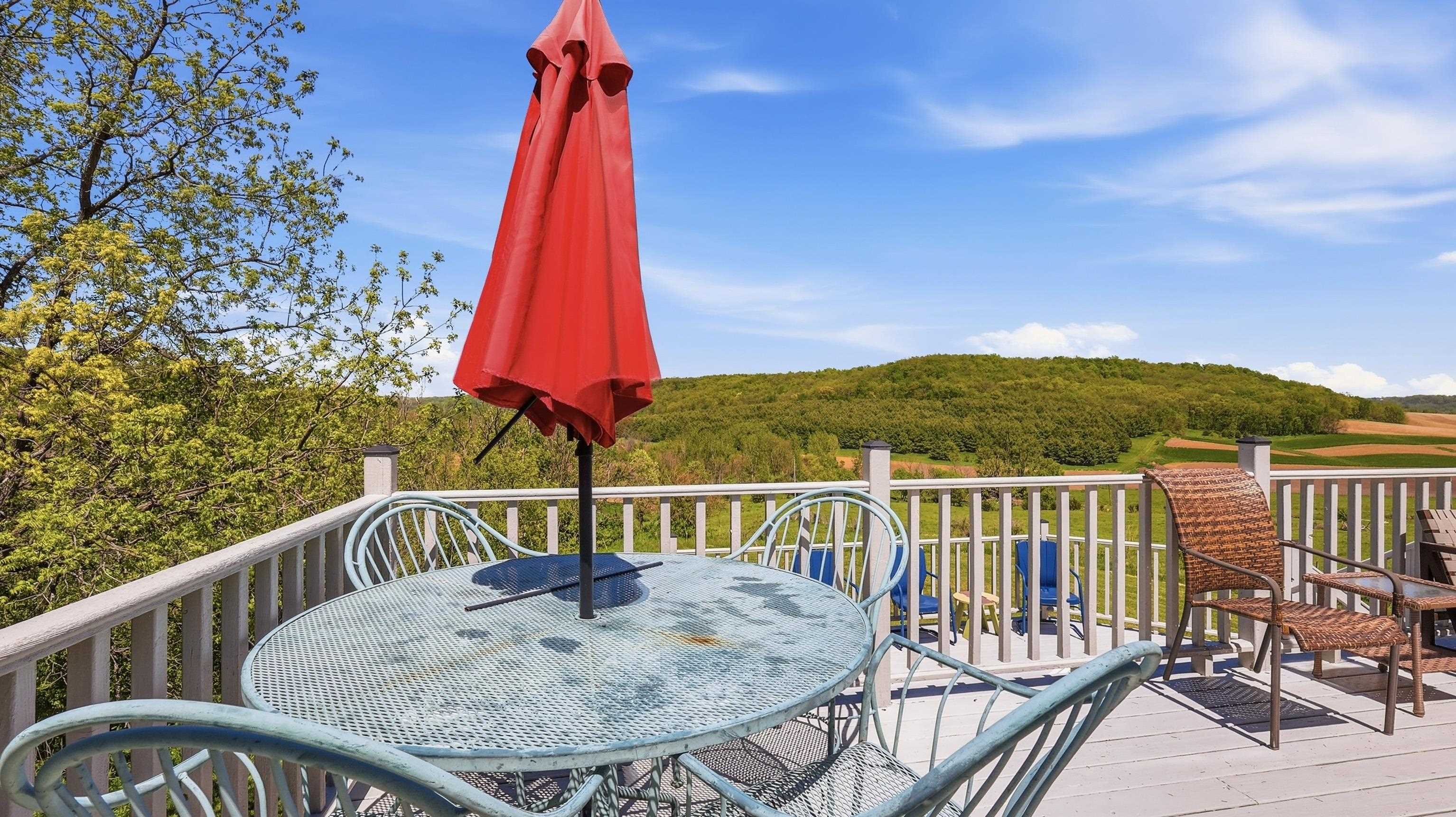 2181 South Irish Hollow Road Galena, IL 61036 - Photo 41 of 48 a balcony with a table and chairs