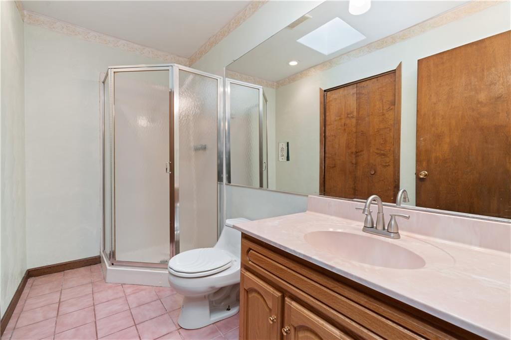 1302 Rankin Road McKeesport, PA 15131 - Photo 16 of 38 a bathroom with a sink a toilet and shower