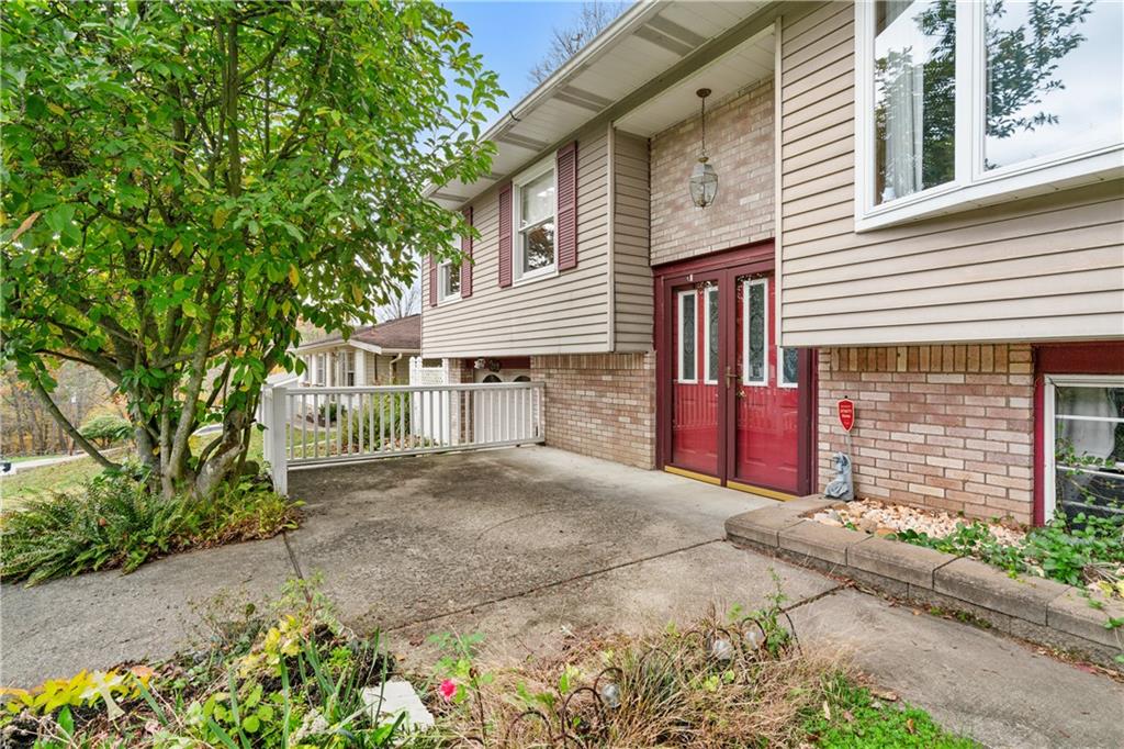 1302 Rankin Road McKeesport, PA 15131 - Photo 2 of 38 a front view of a house with a yard and garage