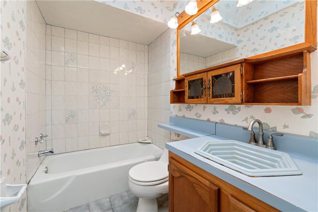 1302 Rankin Road McKeesport, PA 15131 - Photo 22 of 38 a bathroom with a sink a toilet and shower