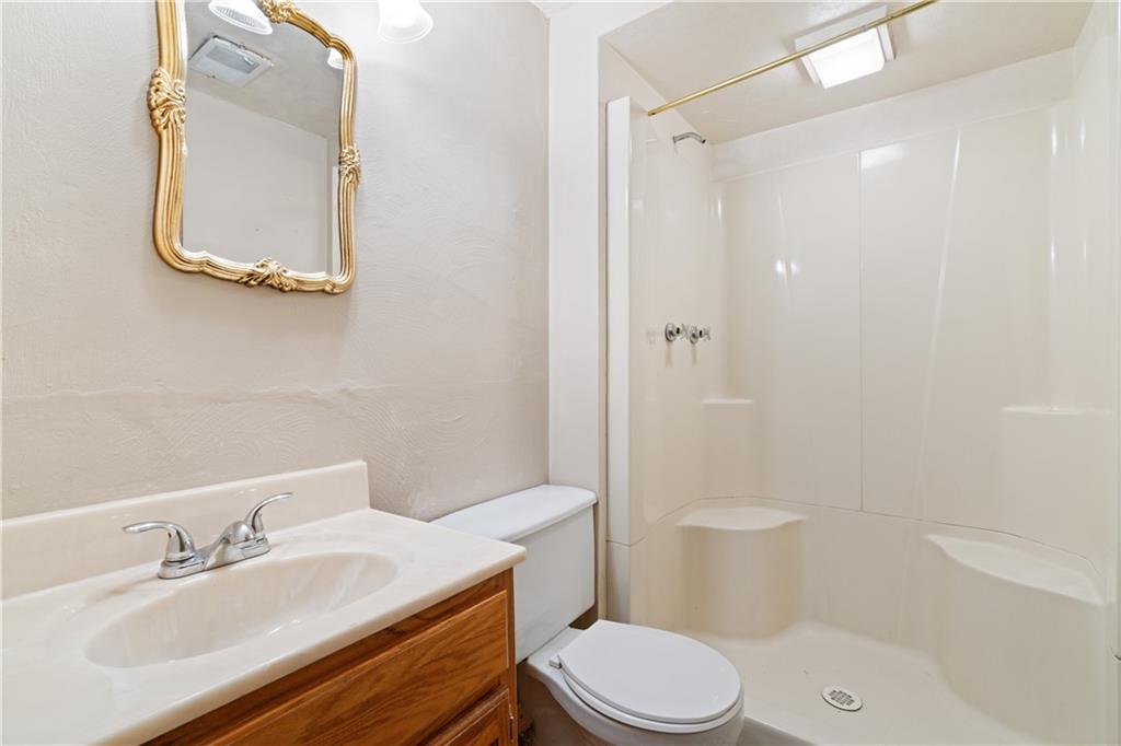 1302 Rankin Road McKeesport, PA 15131 - Photo 25 of 38 a bathroom with a sink a toilet and shower