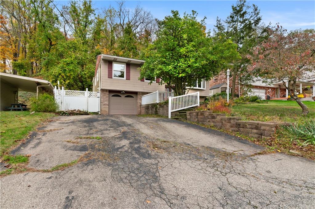 1302 Rankin Road McKeesport, PA 15131 - Photo 31 of 38 a front view of a house with a yard and garage