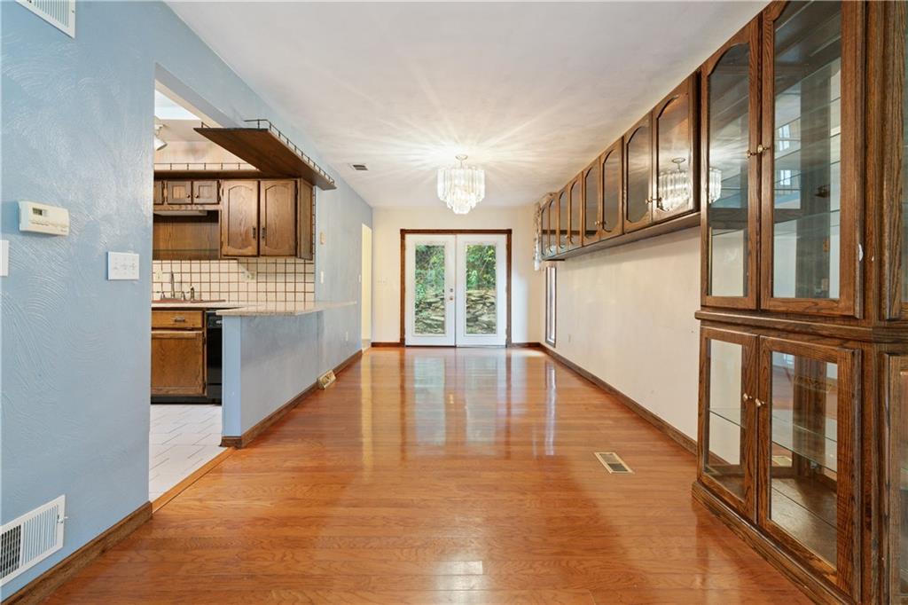 1302 Rankin Road McKeesport, PA 15131 - Photo 7 of 38 a view of an entryway with wooden floor and door