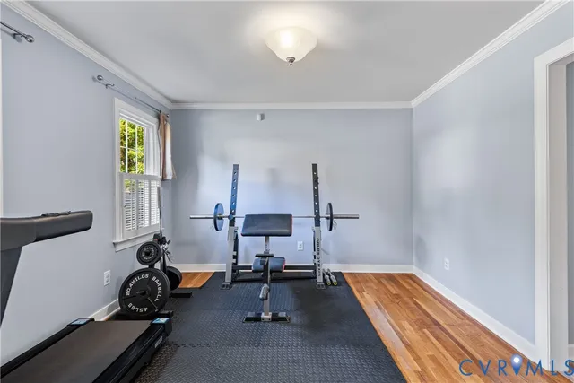 a room with gym equipment and a window