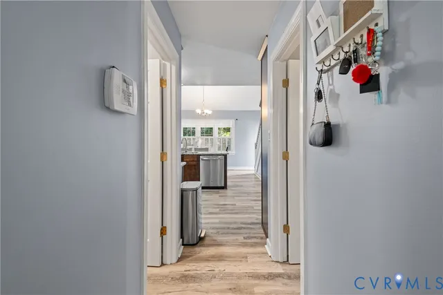 a bathroom with a granite countertop sink vanity mirror and toilet