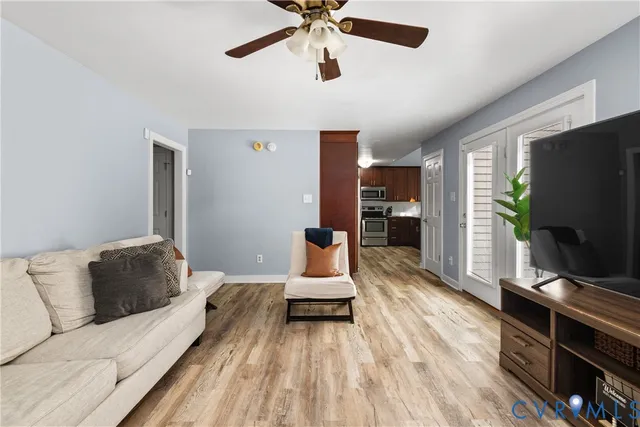 a kitchen with granite countertop wooden cabinets and stainless steel appliances