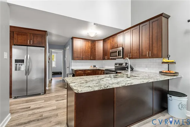 a kitchen with a sink and cabinets