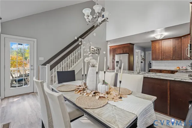 a view of hallway with livingroom and stairs