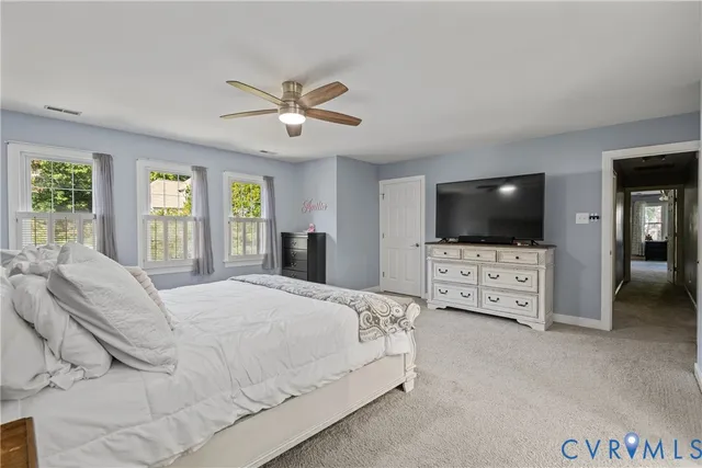 a bathroom with a sink double vanity granite tub and a mirror