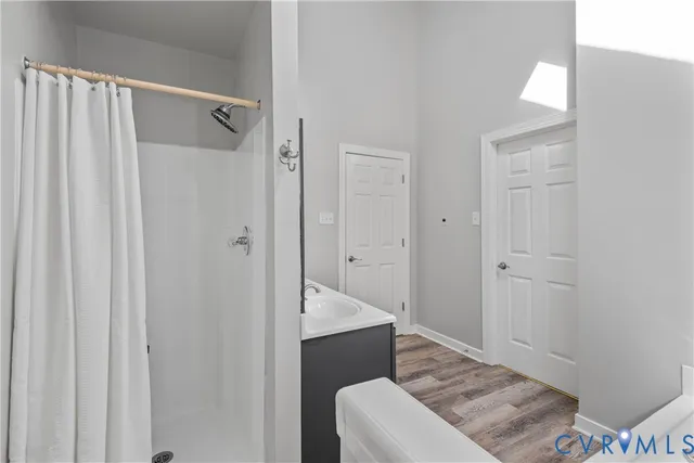 a bedroom that has a bed and a chair in it