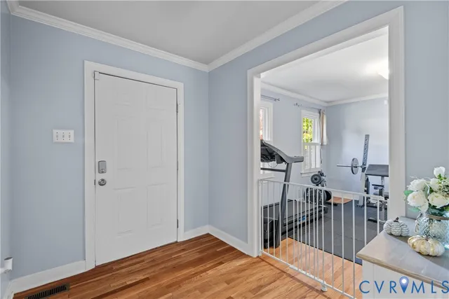 a view of entryway with wooden floor