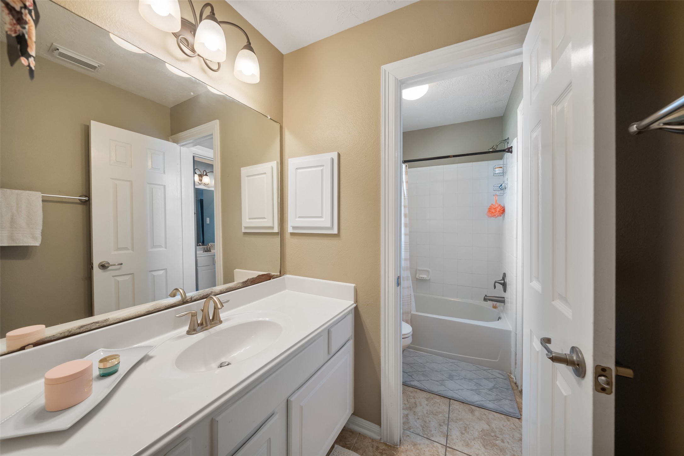 6407 Ashley Manor Drive Spring, TX 77389 - Photo 28 of 41 a bathroom with a sink double vanity and a mirror