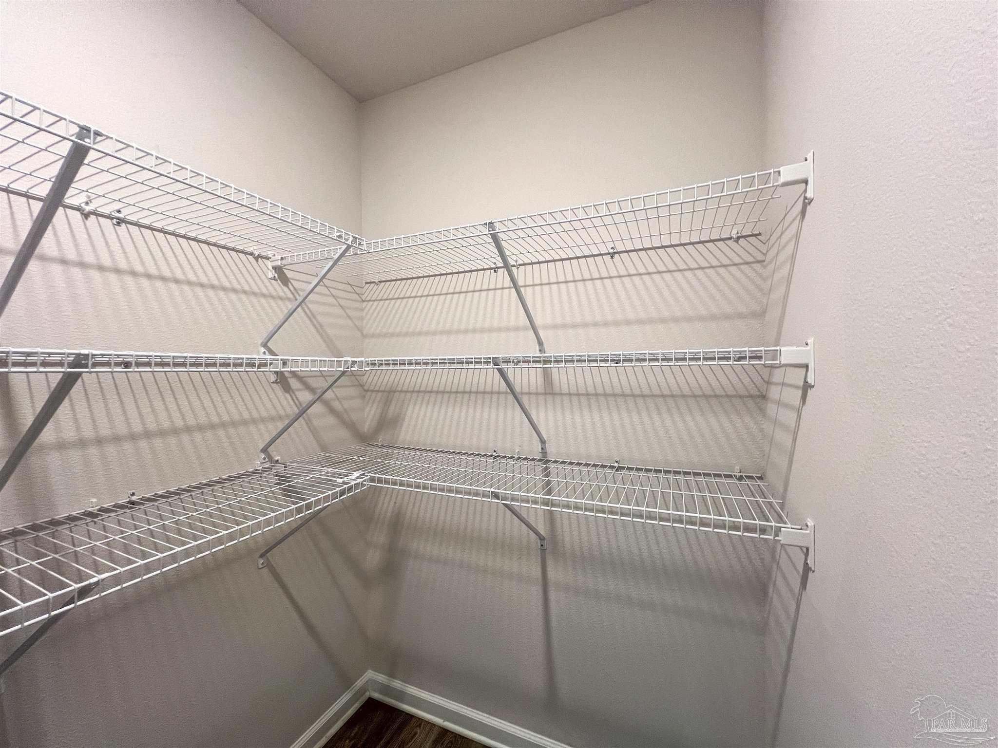 5257 Peach Drive Pace, FL 32571 - Photo 17 of 28 a view of a room with racks on the wall