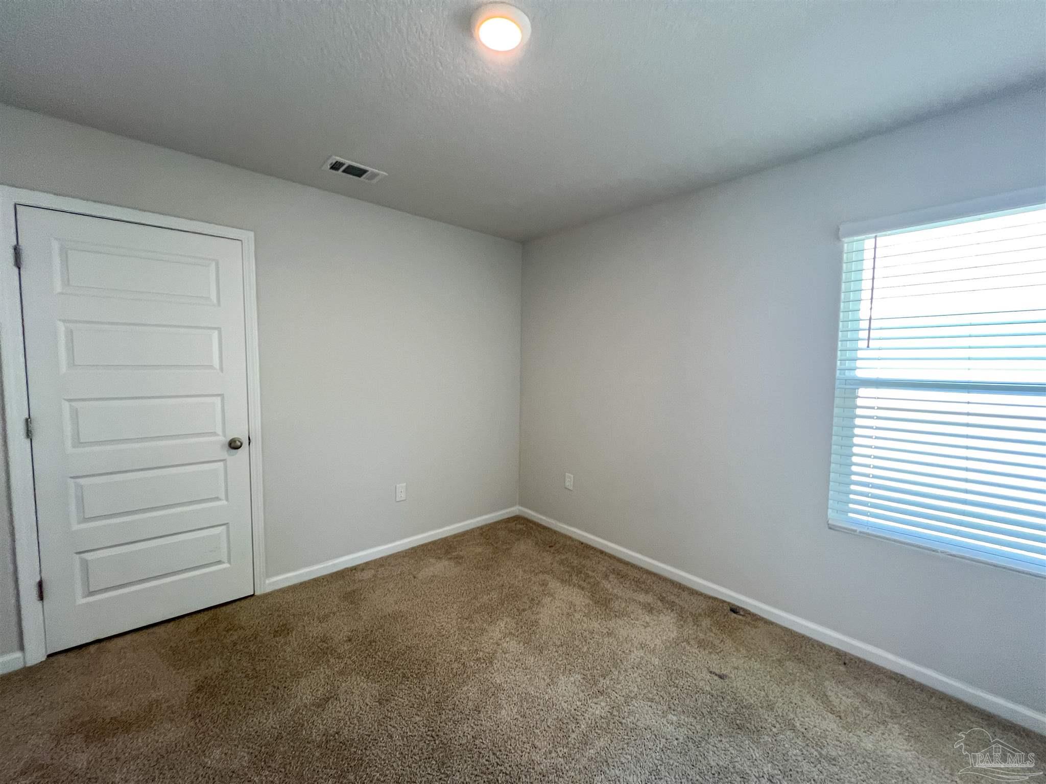 5257 Peach Drive Pace, FL 32571 - Photo 18 of 28 an empty room with a window