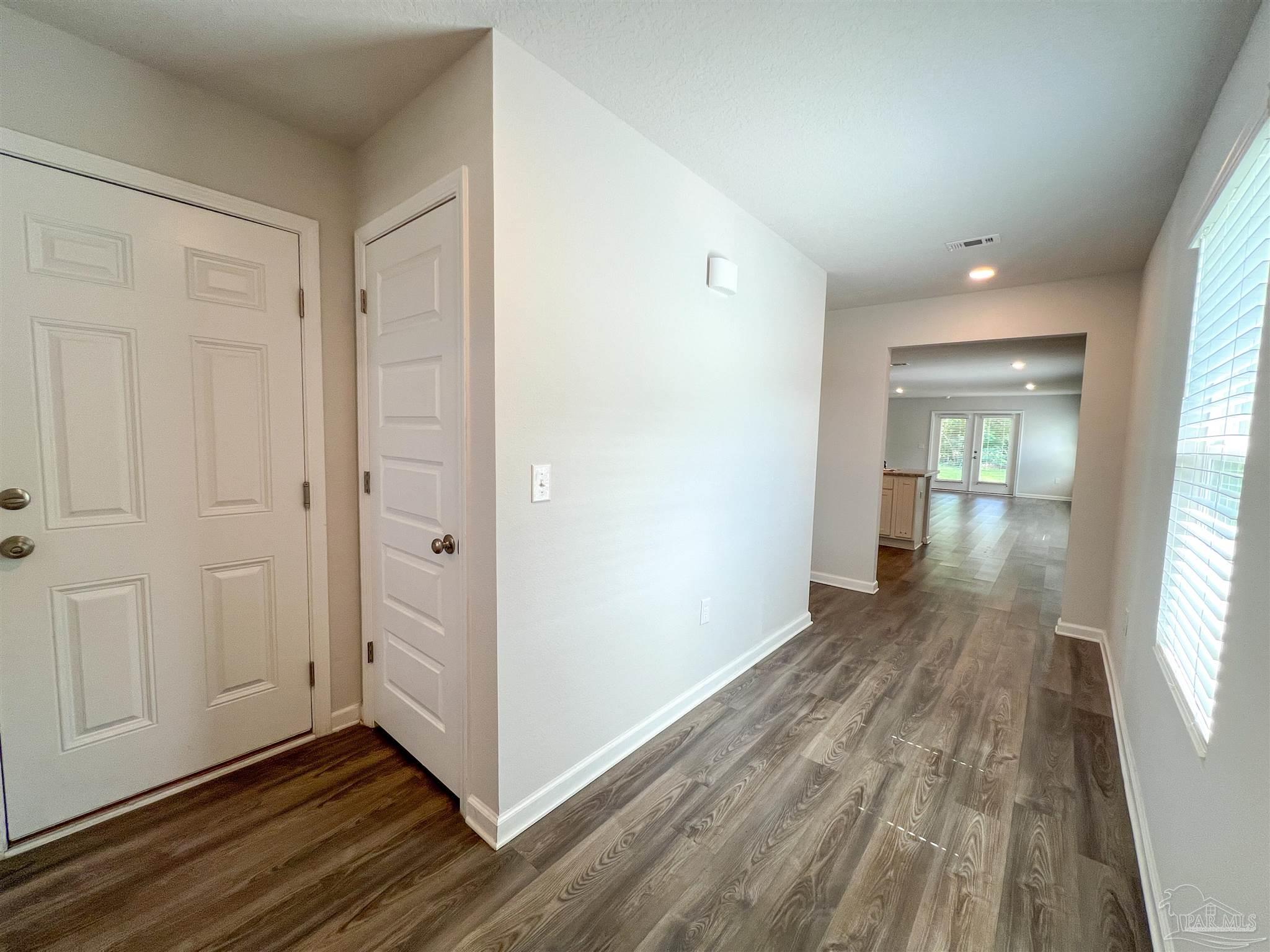 5257 Peach Drive Pace, FL 32571 - Photo 2 of 28 a view of wooden floor in an empty room