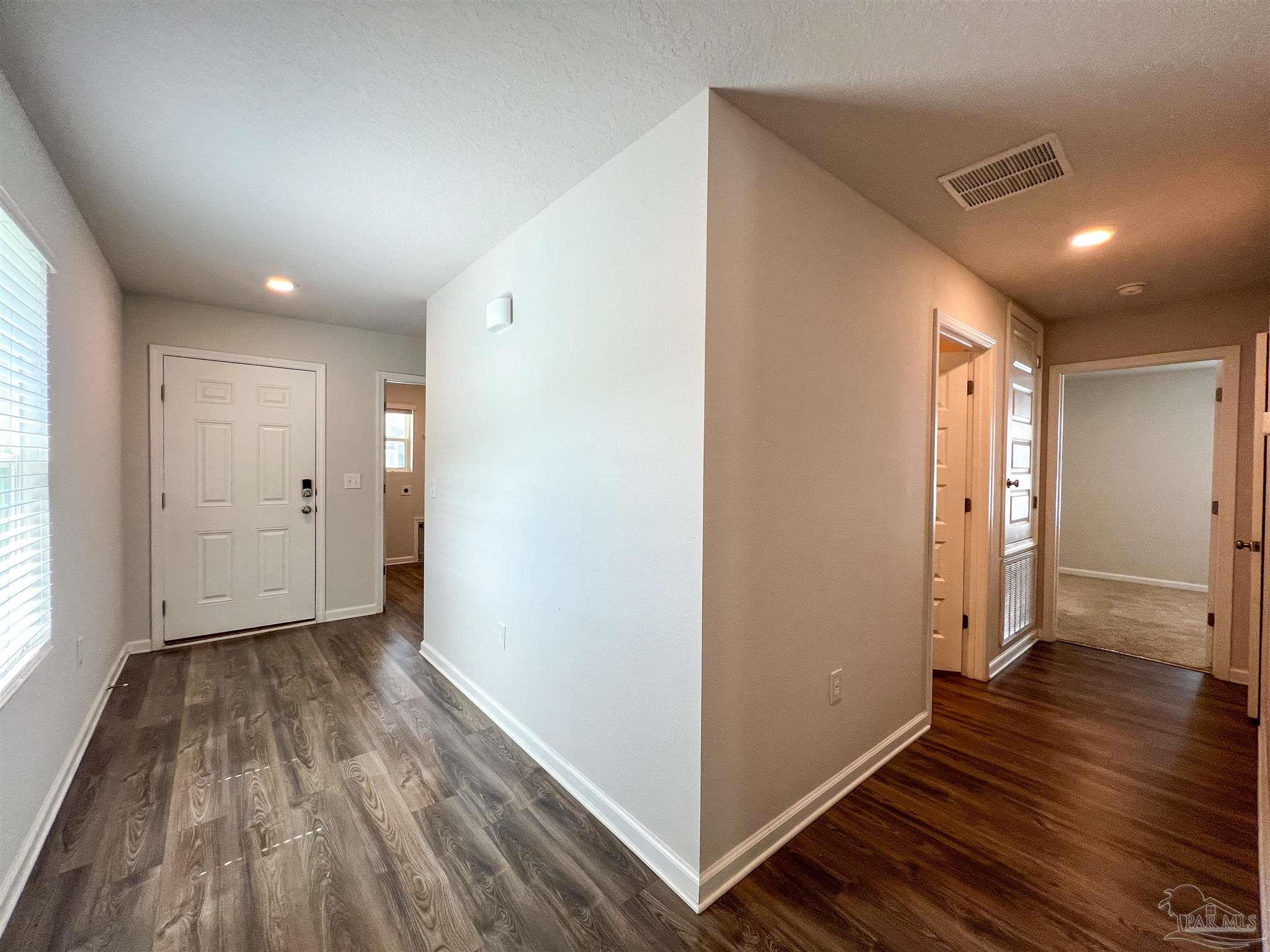 5257 Peach Drive Pace, FL 32571 - Photo 21 of 28 a view of hallway with wooden floor