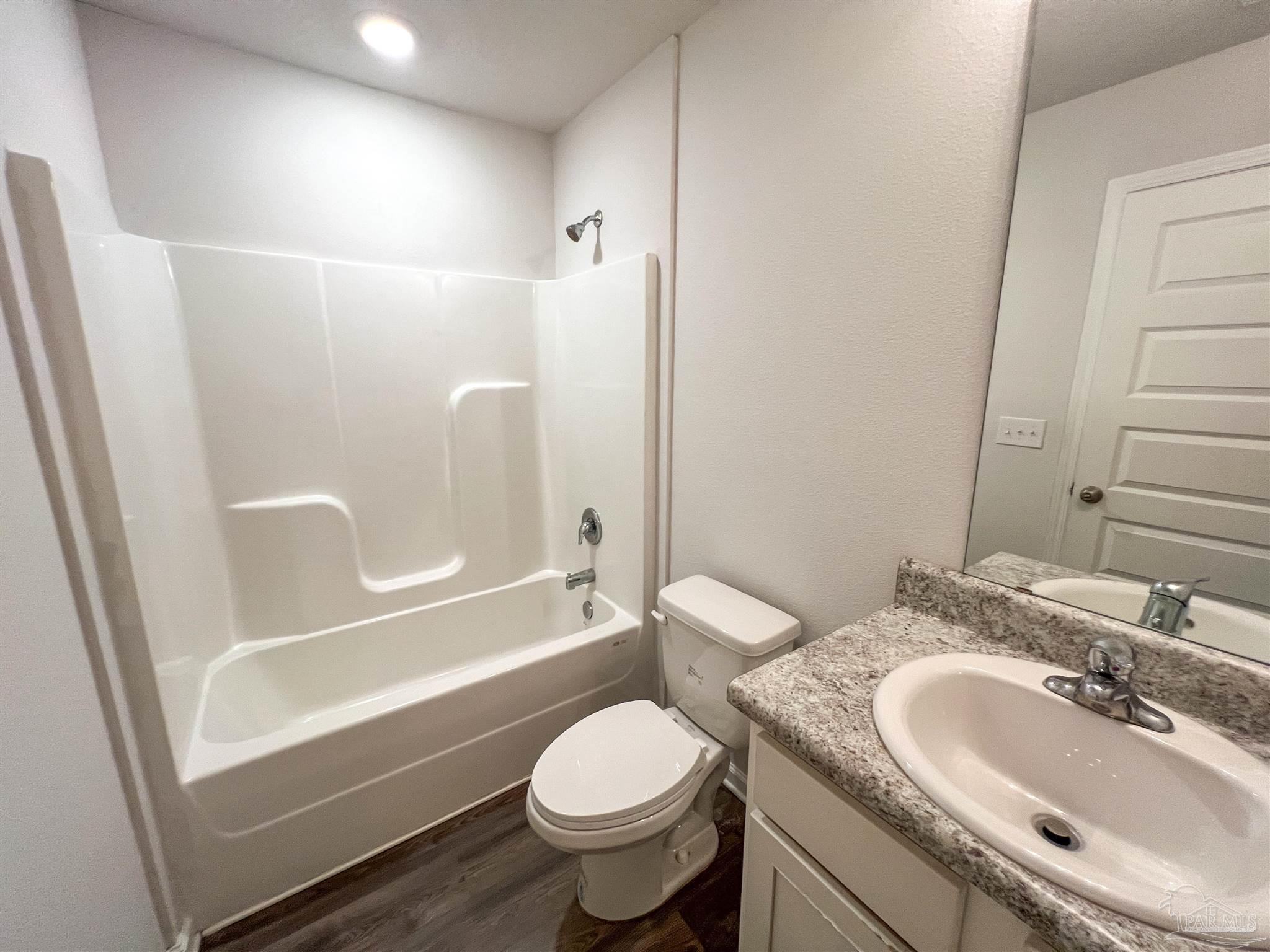 5257 Peach Drive Pace, FL 32571 - Photo 22 of 28 a bathroom with a sink toilet and shower
