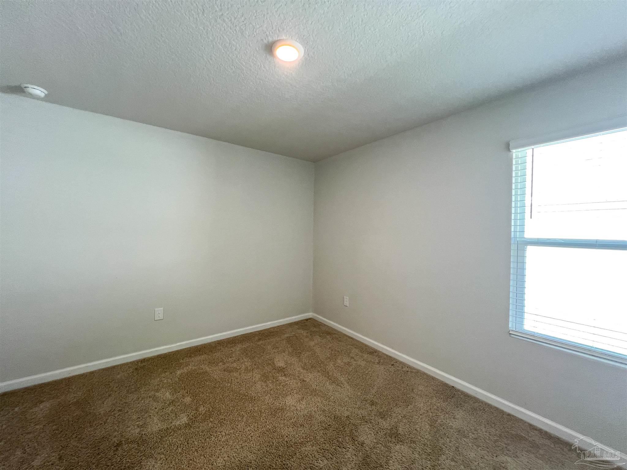 5257 Peach Drive Pace, FL 32571 - Photo 23 of 28 an empty room with a window