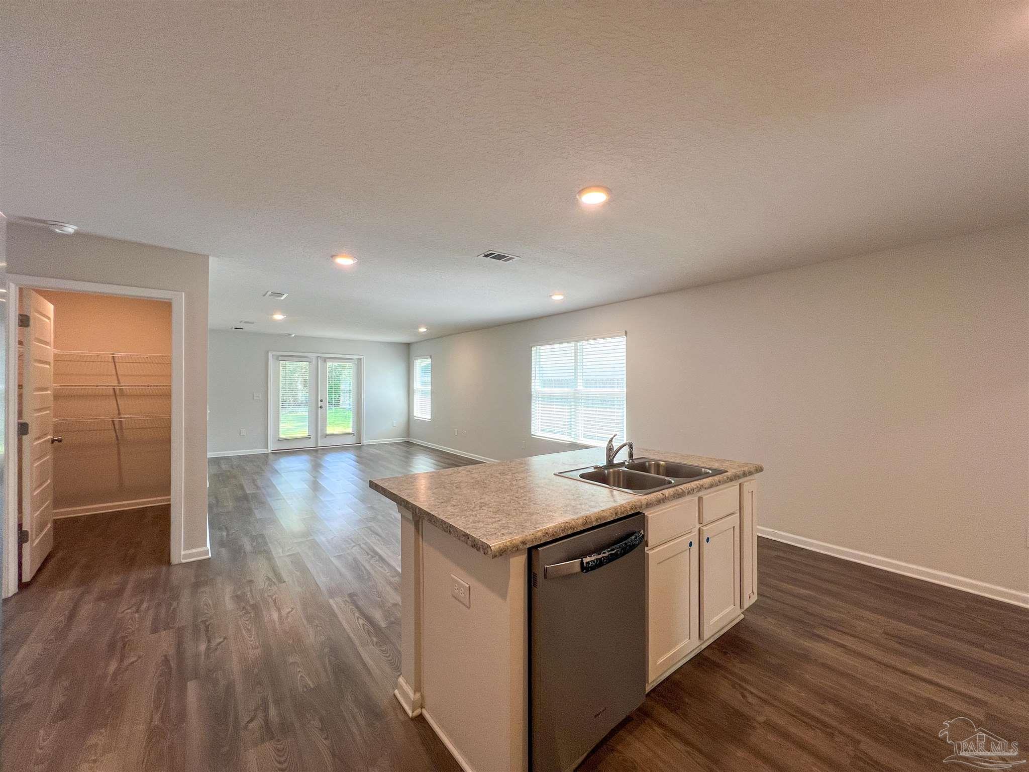 5257 Peach Drive Pace, FL 32571 - Photo 8 of 28 a kitchen with a sink stove and cabinets