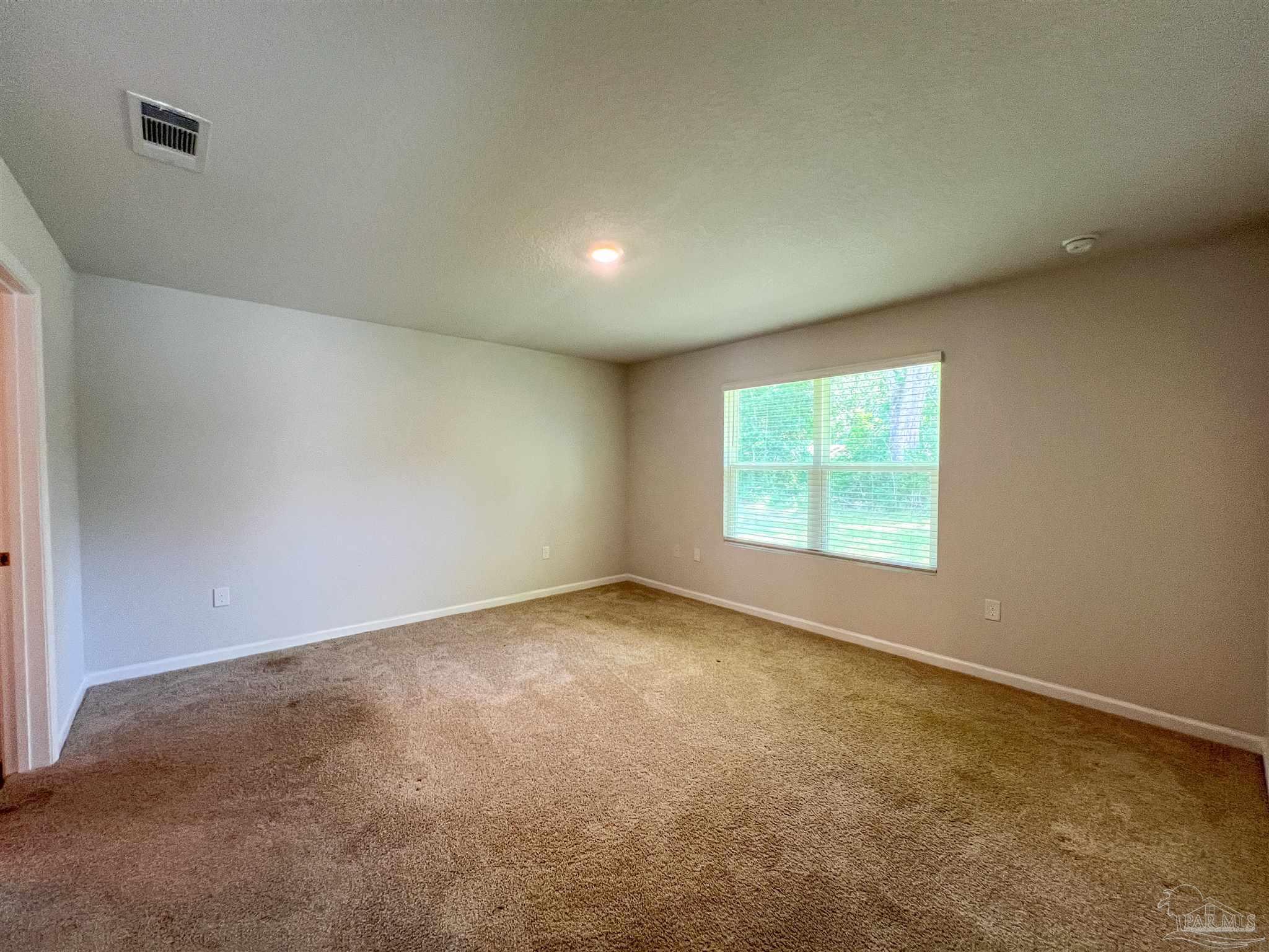 5257 Peach Drive Pace, FL 32571 - Photo 9 of 28 an empty room with a window