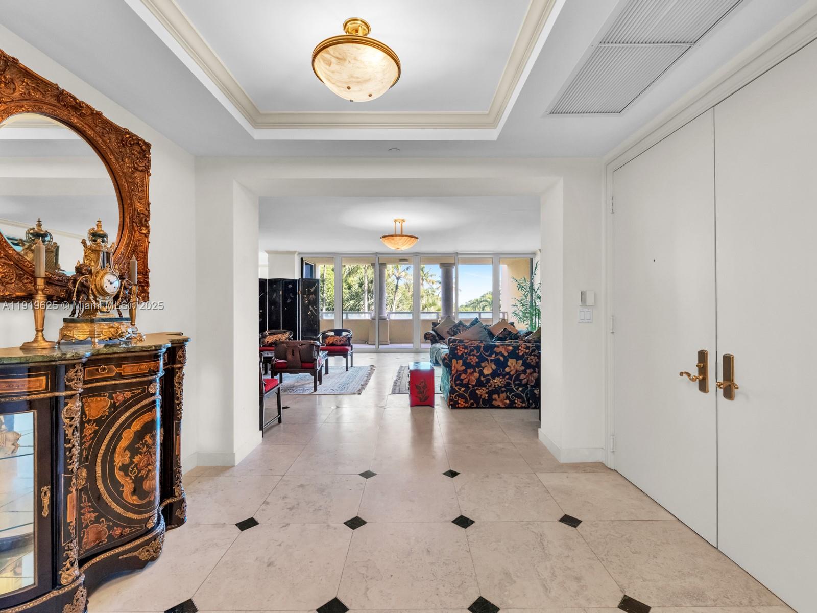 445 Grand Bay Drive, Unit 303 Key Biscayne, FL 33149 - Photo 12 of 52 a view of a livingroom with furniture and hardwood floor