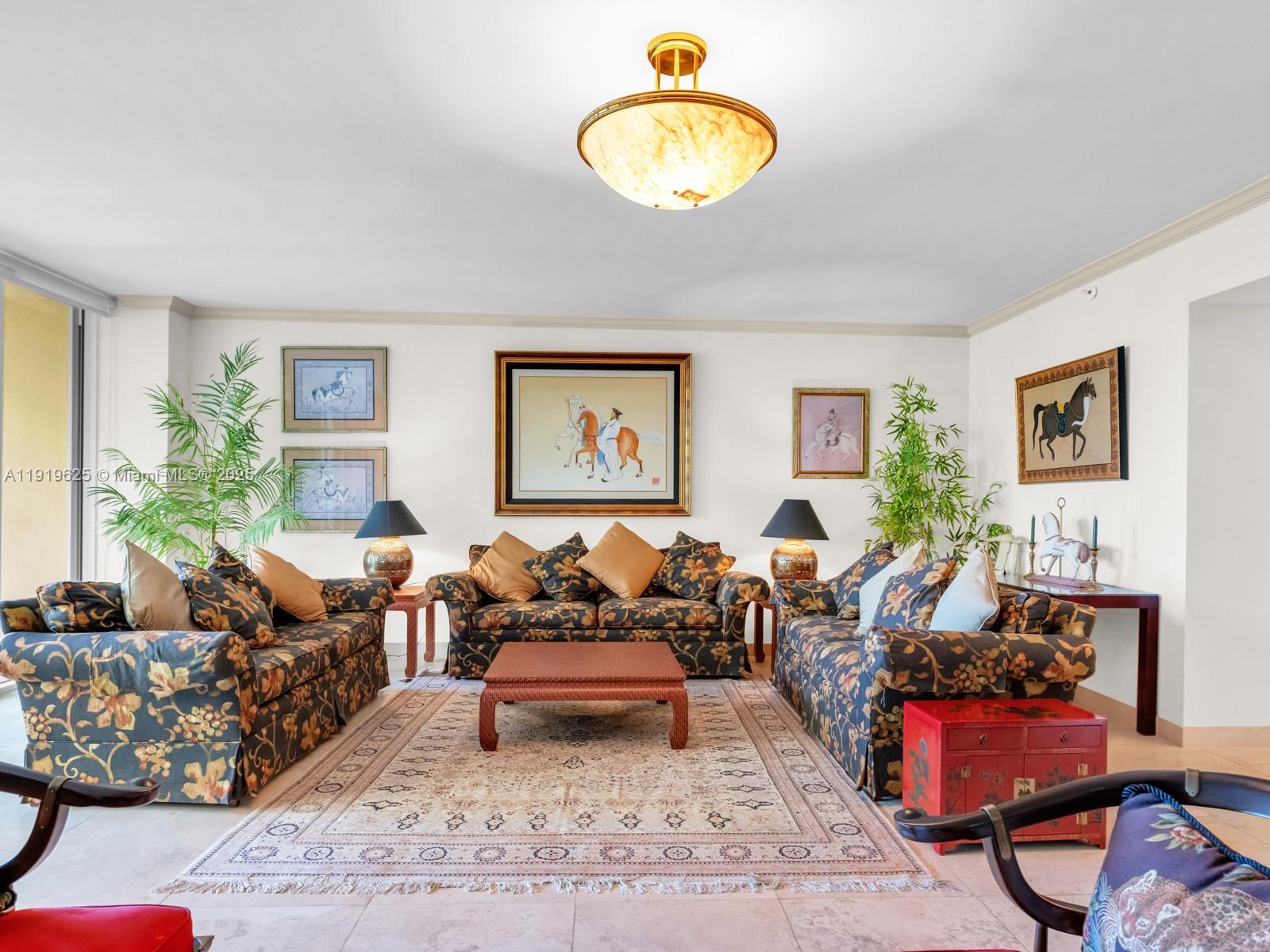 445 Grand Bay Drive, Unit 303 Key Biscayne, FL 33149 - Photo 20 of 52 a living room with furniture and a wooden floor