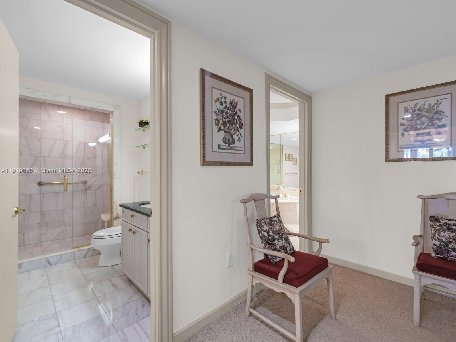 445 Grand Bay Drive, Unit 303 Key Biscayne, FL 33149 - Photo 30 of 52 a bathroom with a toilet and a shower