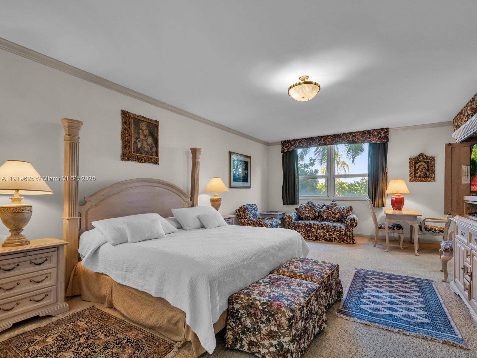 445 Grand Bay Drive, Unit 303 Key Biscayne, FL 33149 - Photo 31 of 52 a bedroom with double bed and a window