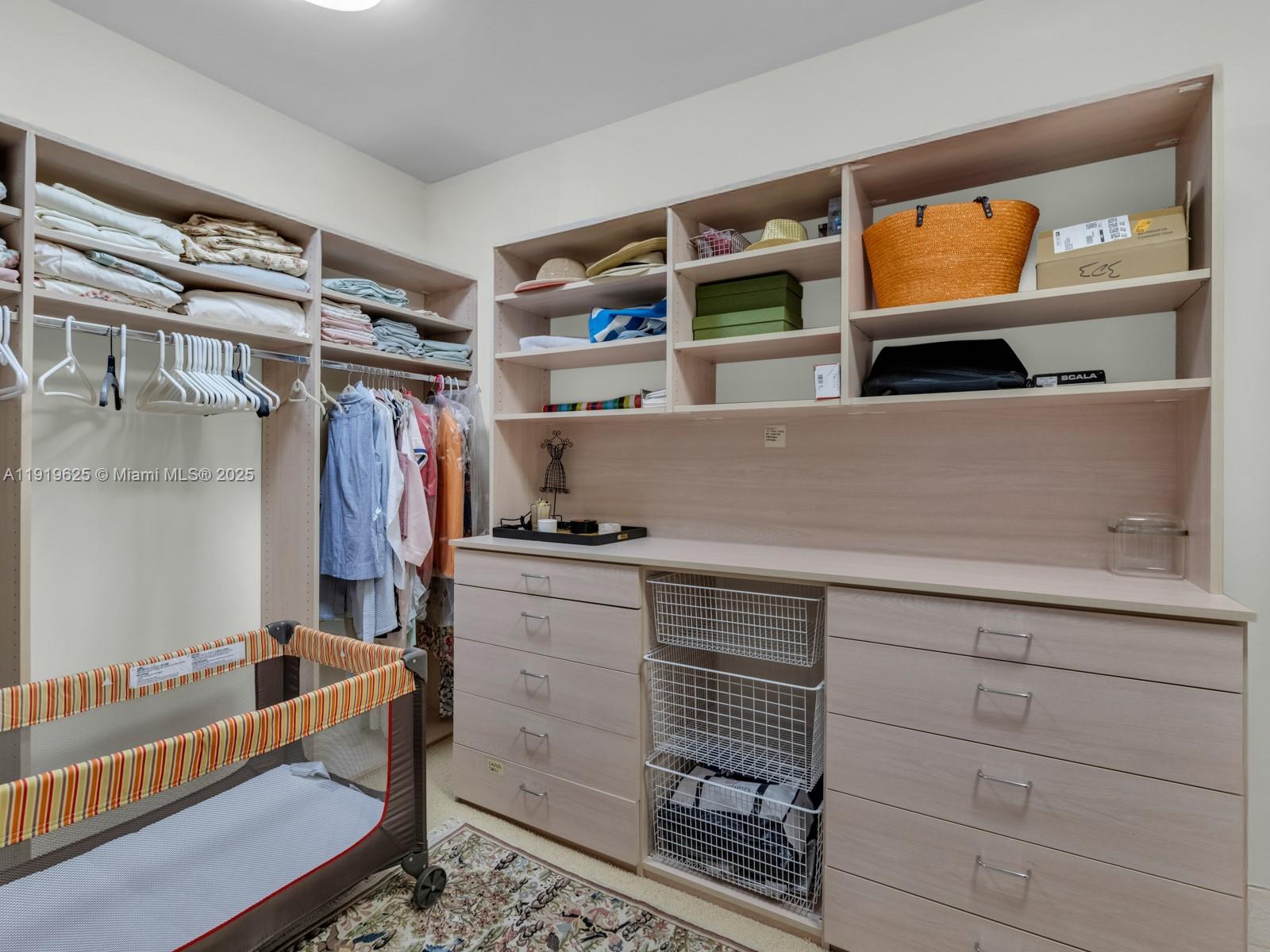 445 Grand Bay Drive, Unit 303 Key Biscayne, FL 33149 - Photo 33 of 52 a kitchen with a cabinets and a window