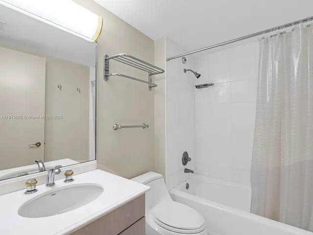 a bed sitting in a bedroom and dresser