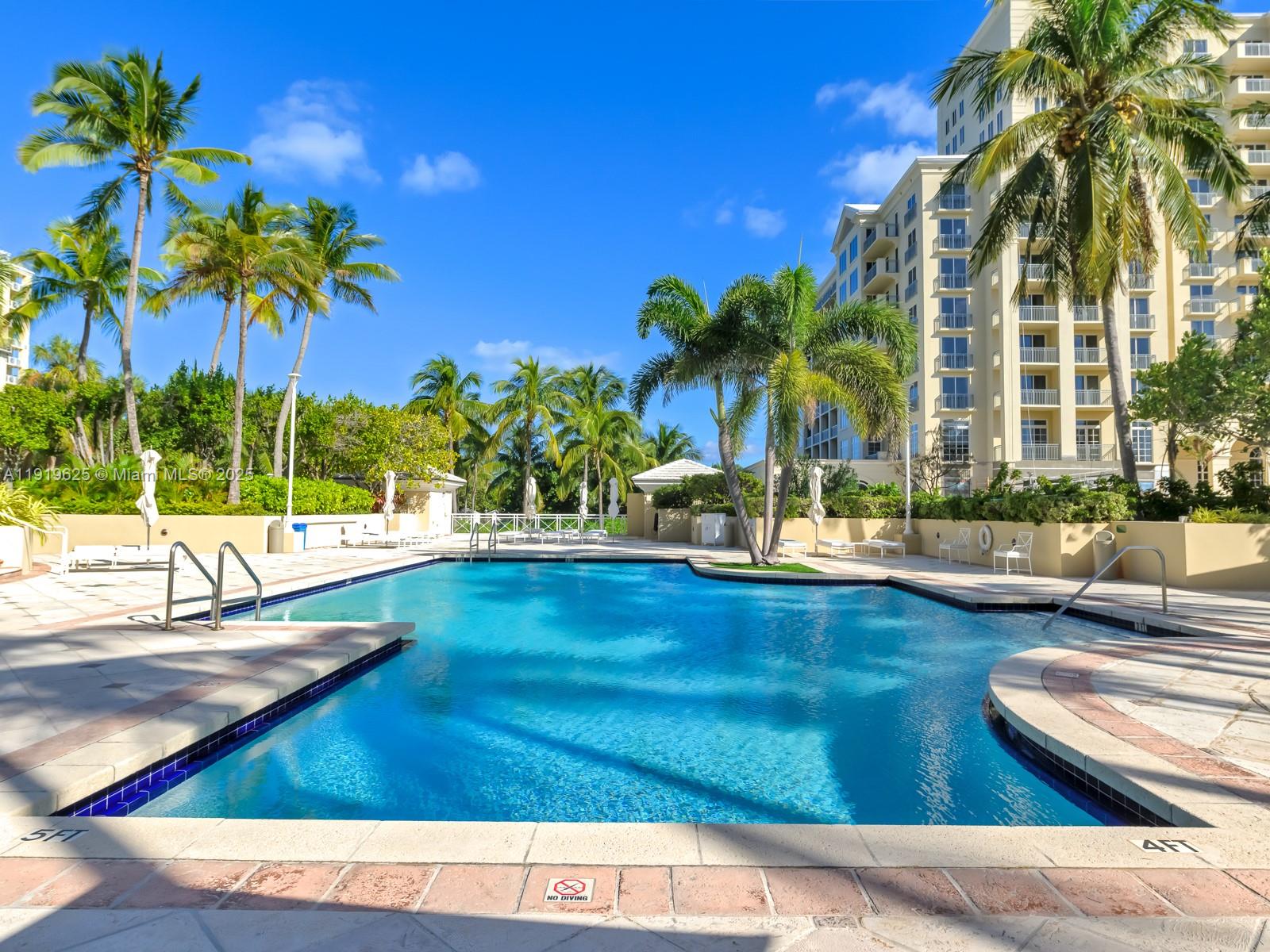 445 Grand Bay Drive, Unit 303 Key Biscayne, FL 33149 - Photo 50 of 52 a view of swimming pool with a patio