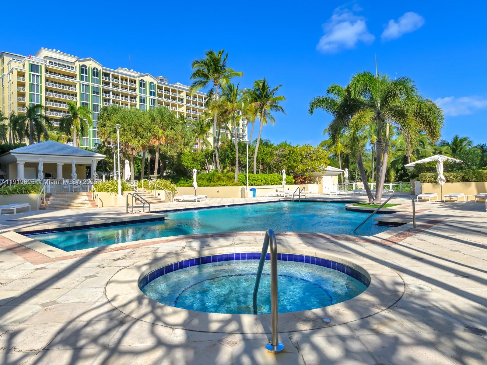 445 Grand Bay Drive, Unit 303 Key Biscayne, FL 33149 - Photo 51 of 52 a view of swimming pool with outdoor seating and plants