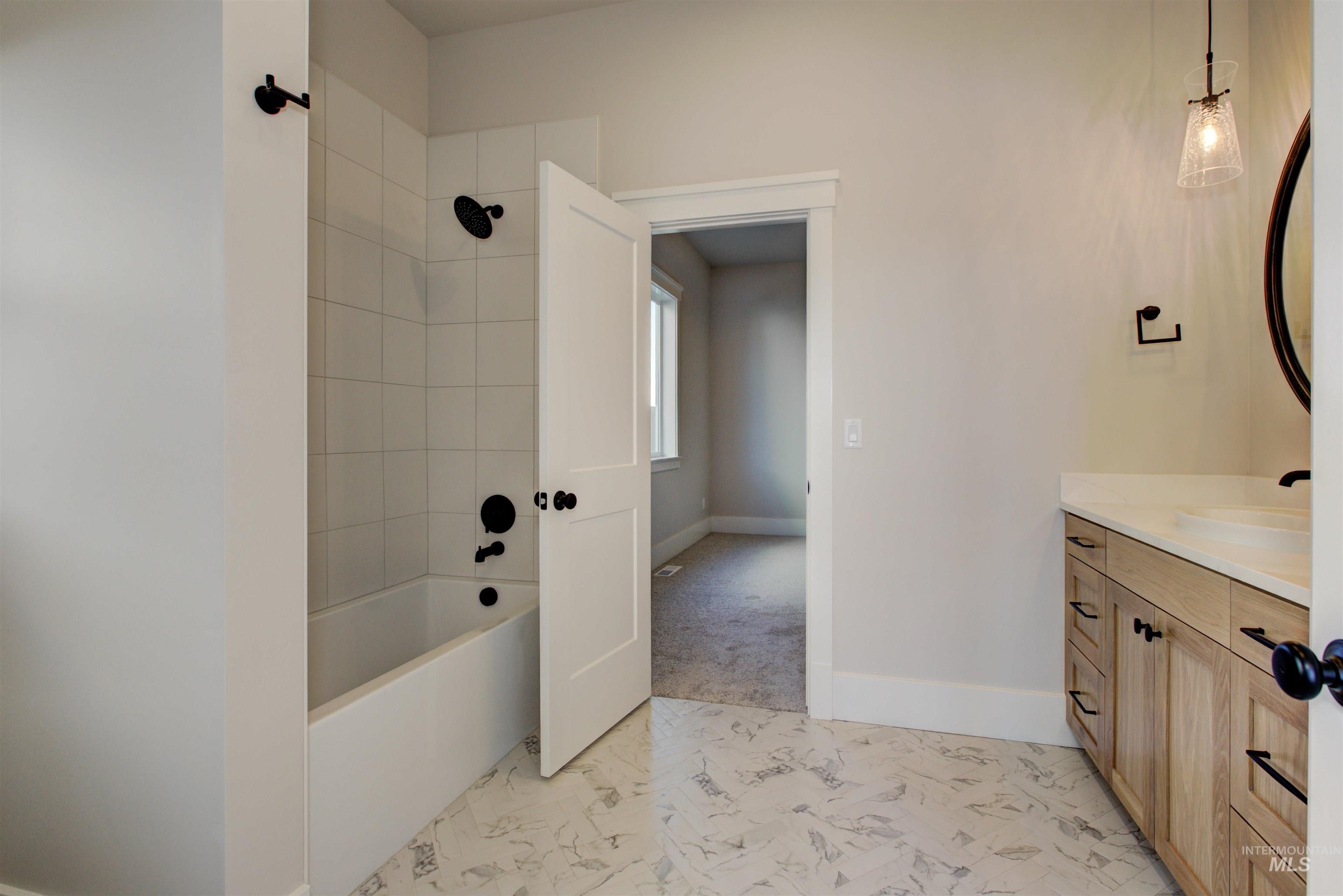 6771 South Messner Way Meridian, ID 83642 - Photo 38 of 45 Full bathroom featuring vanity and bathtub / shower combination