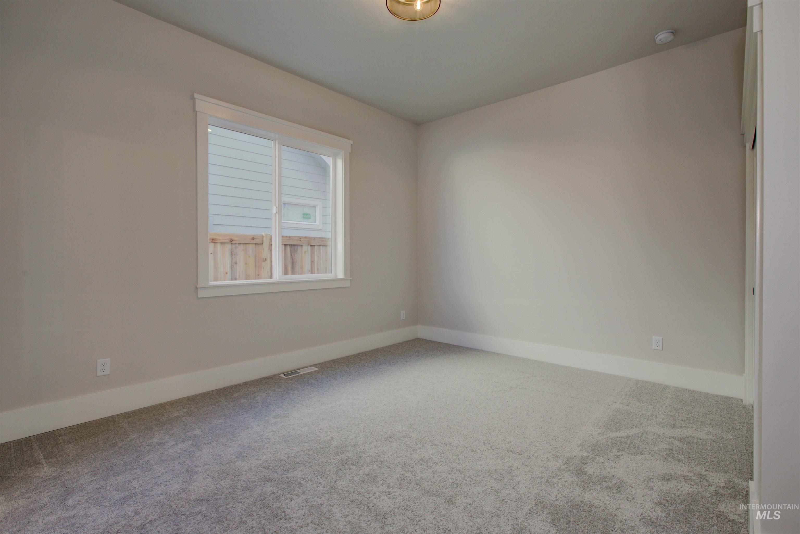 6771 South Messner Way Meridian, ID 83642 - Photo 40 of 45 Carpeted empty room featuring baseboards