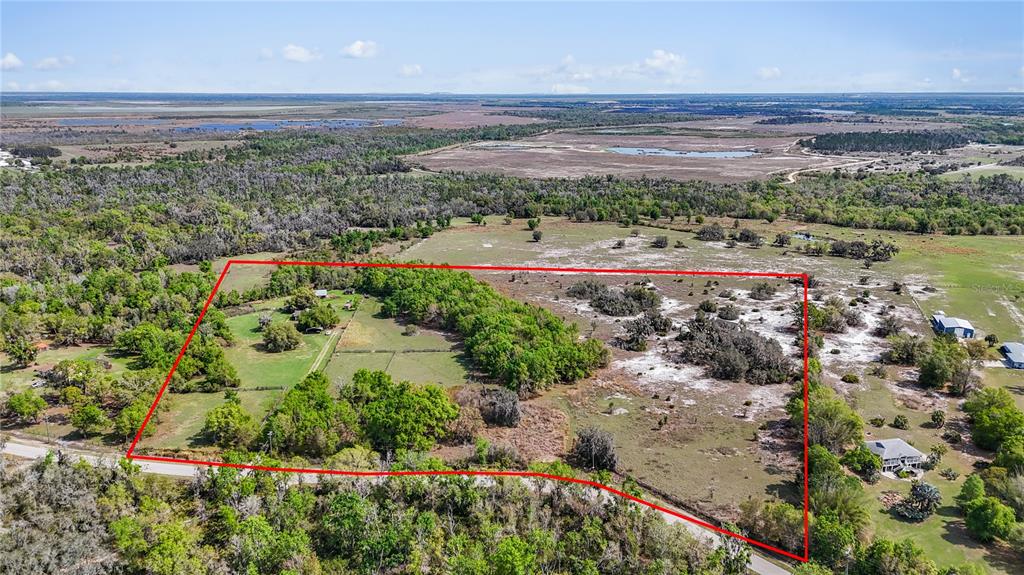 32430 Taylor Grade Parrish, FL 34219 - Photo 1 of 15 a view of a lake with a yard