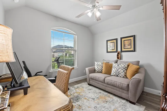 a living room with furniture and a window