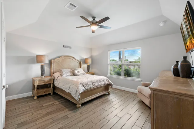 a bedroom with a bed and window