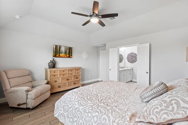 a bedroom with a bed couch and window