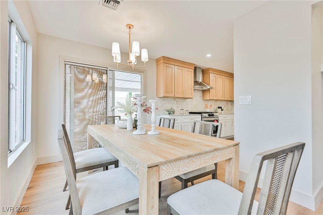 9337 Quail Ridge Drive Las Vegas, NV 89134 - Photo 14 of 28 Dining room with a chandelier, light wood-type flooring, and recessed lighting