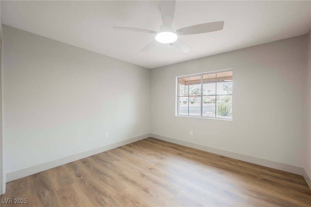 9337 Quail Ridge Drive Las Vegas, NV 89134 - Photo 24 of 28 Unfurnished room with light wood-type flooring and a ceiling fan